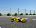 Blokada parkingowa wzór 1 żółto-czarna na parkingu .jpg