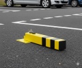 Blokada parkingowa wzór 9 w spoczynku żółto czarna.jpg